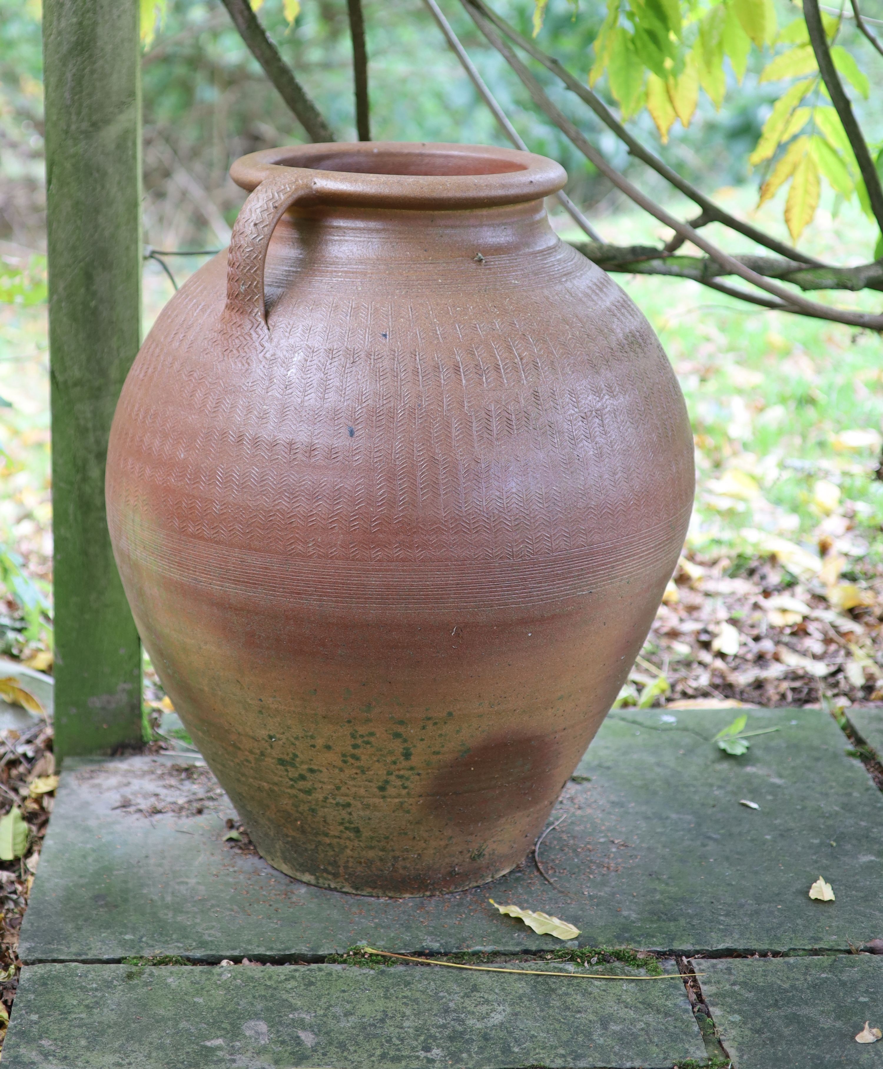 A two handled terracotta garden urn, height 73cm